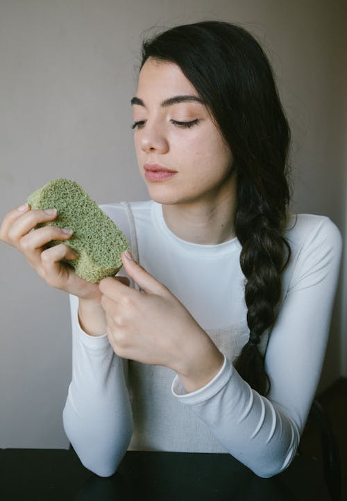 Free Photo of a Woman Holding a Green Sponge Stock Photo