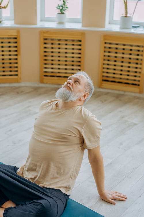 Man in Beige Shirt Doing a Backbend