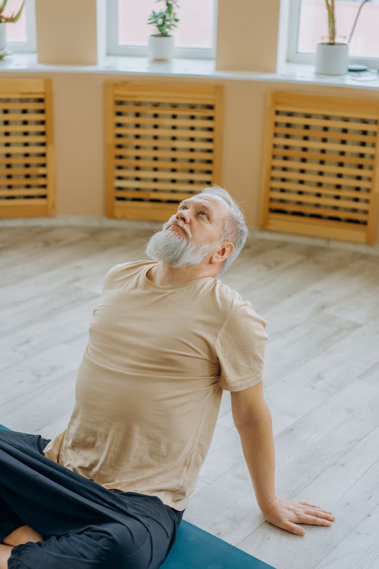 Man In Beige Shirt Doing A Backbend