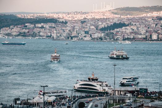 Ferries and watercraft navigate the Bosphorus Strait in Istanbul, Turkey, offering stunning city views.