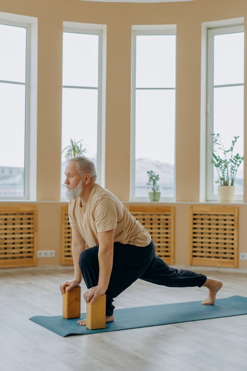 Elderly Man Doing Yoga Exercise
