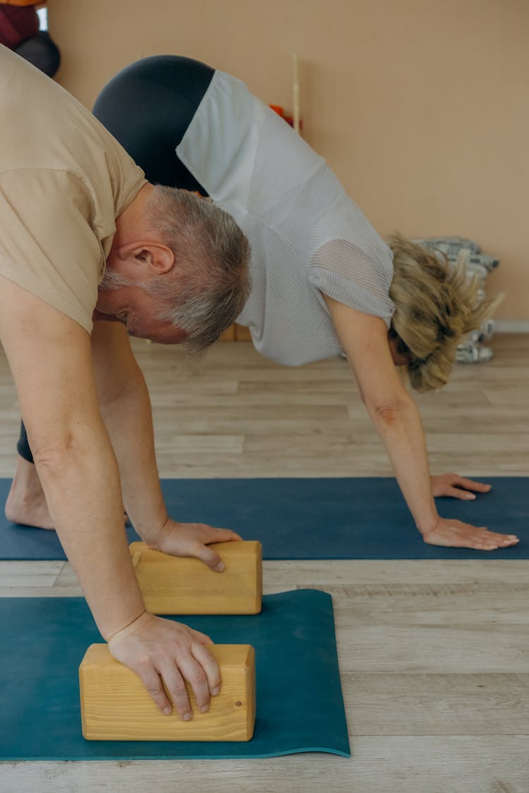 Elderly Couple Doing Yoga Exercise