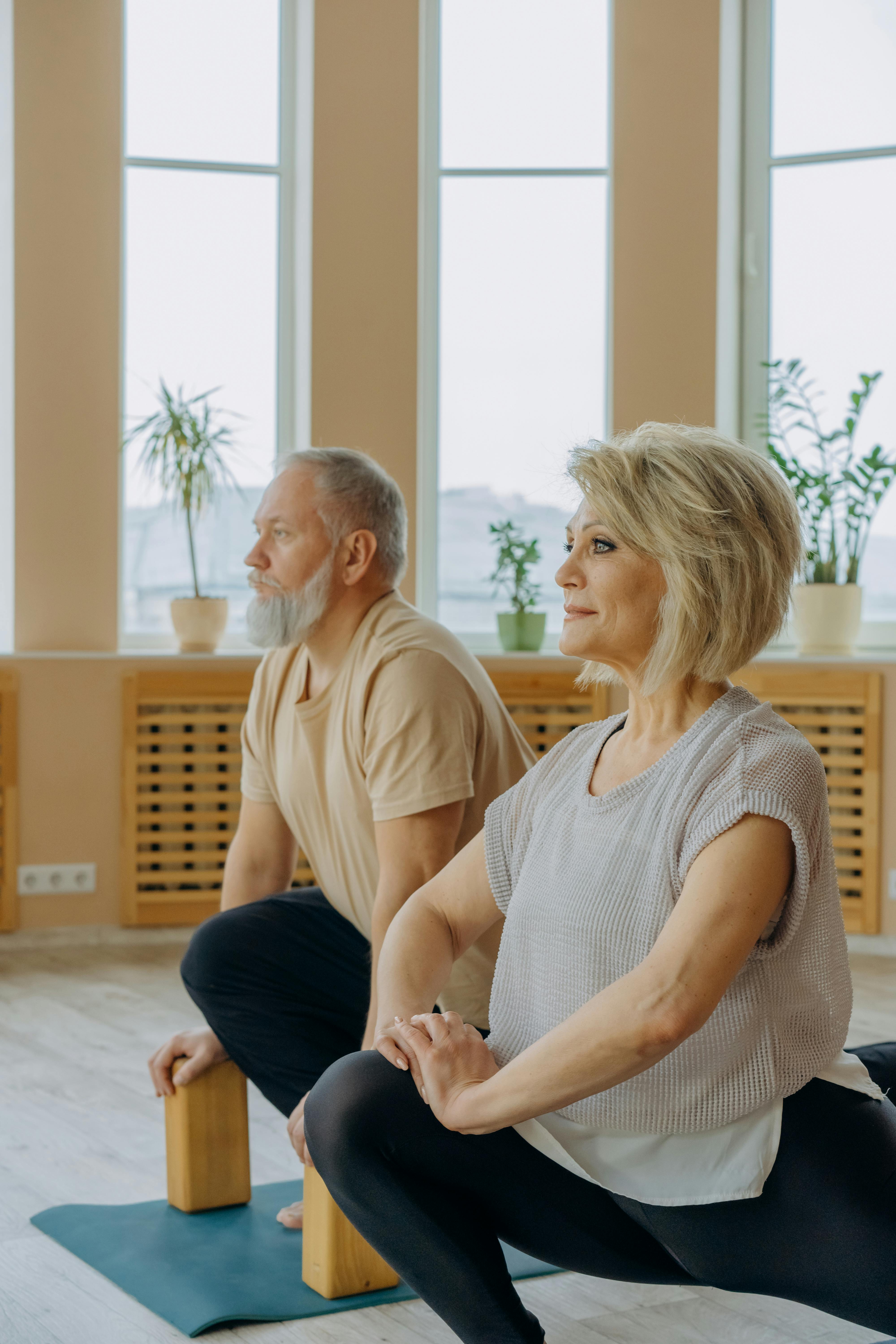 Free Man in Gray Tank Top Sitting Beside Woman in Gray Tank Top Stock Photo