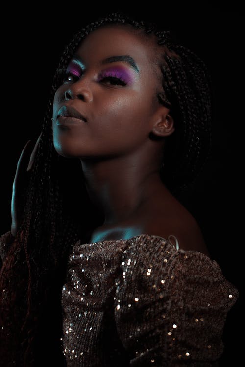 Close-Up Shot of a Woman in Her Braided Hairstyle