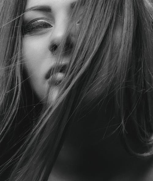 Monochrome Photo of a Woman's Hair Covering Her Face