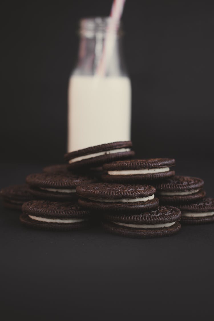 Photograph Of Oreo Cookies On A Black Surface