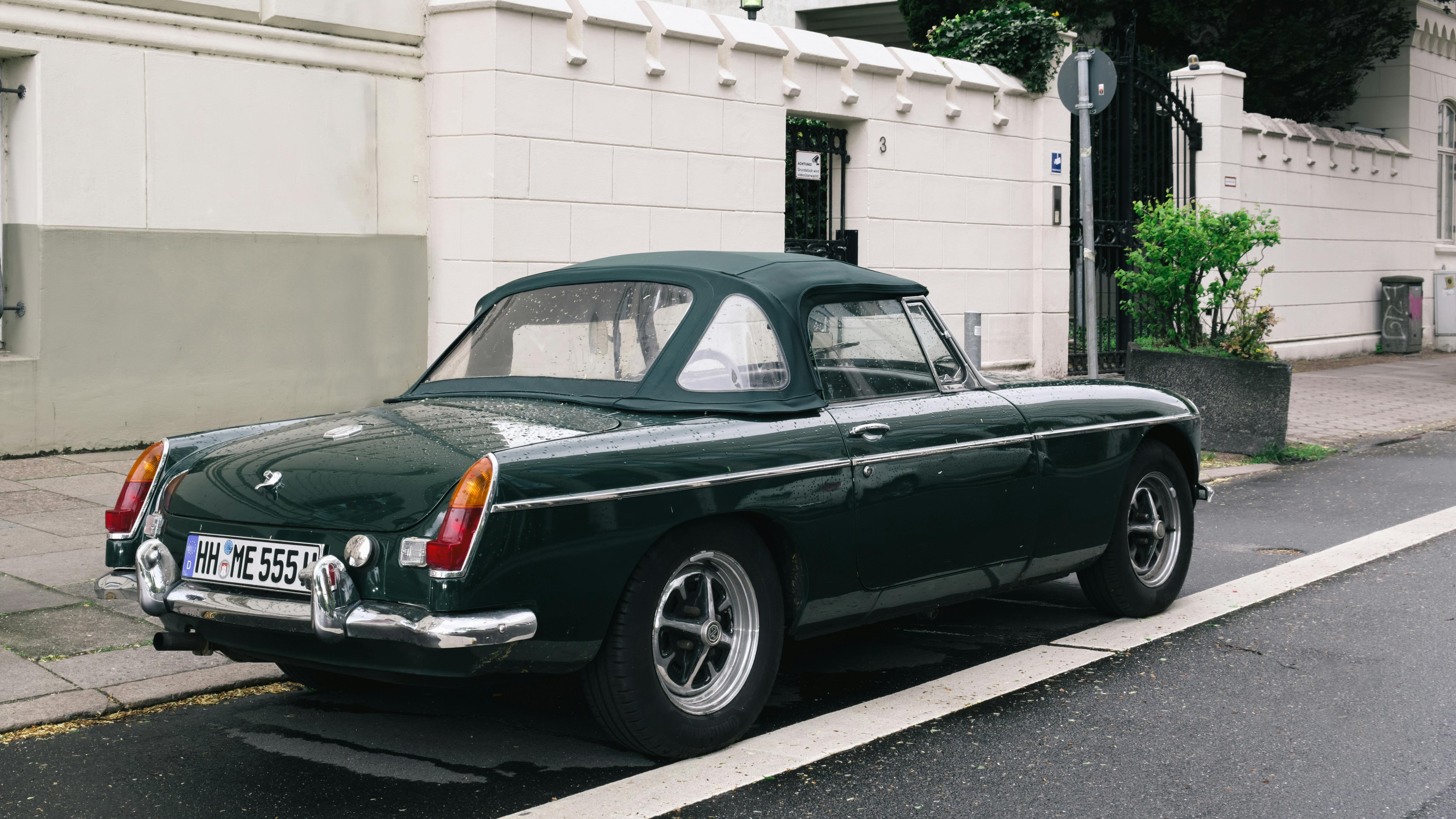 A Parked Dark Green Convertible · Free Stock Photo
