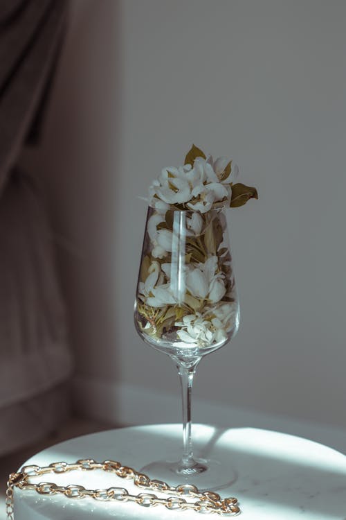 A Glass Filled with White Flowers