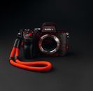 Black Nikon Dslr Camera on Black Surface
