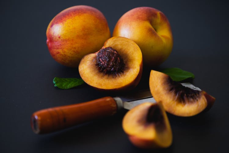 A Close-Up Shot Of Sliced Peaches