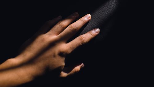 Free Close-up image of a hand with dramatic shadows, highlighting texture and light play. Stock Photo