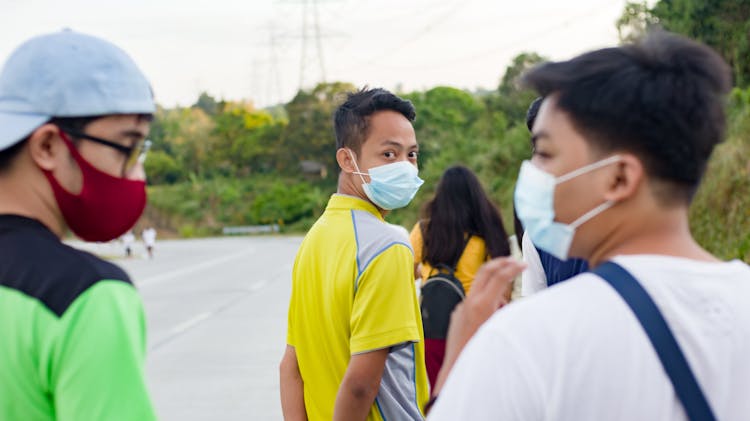 Group Of Asian Teenagers Walking In Park