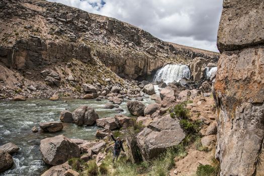 Explore the rugged beauty of Arequipa, Peru, with cascading waters and unique rock formations.