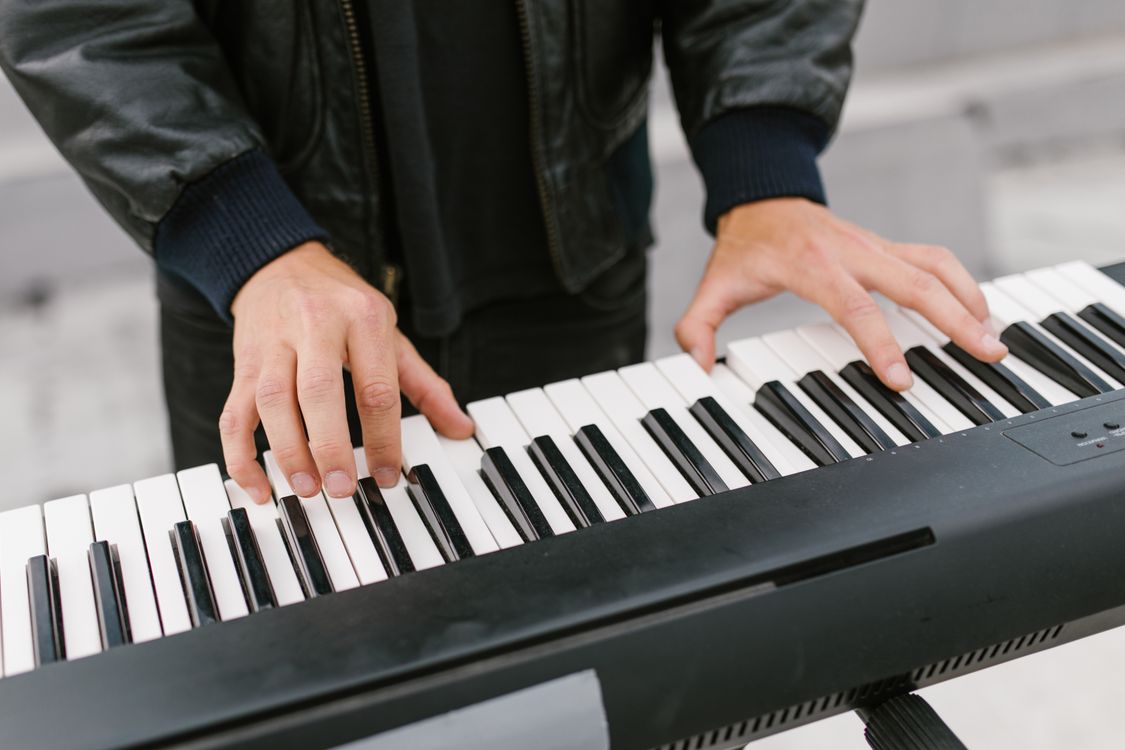 Keyboard Instrument Play A Person in Black Jacket Playing the Electronic Keyboard · Free Stock Photo
