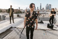 A Group of Musicians Practicing on the Rooftop
