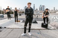 Man wearing Black Leather Jacket and Tattered Jeans