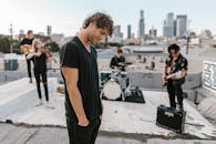 Smiling Man in Black Shirt