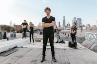 Man in Black Shirt with his Arms Crossed