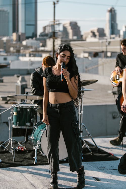 A Woman Singing on a Rooftop