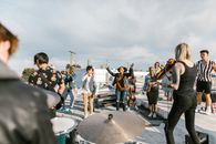 Group of People Playing Musical Instruments on the Street