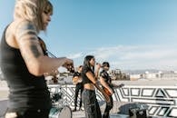 A Band with a Woman Vocalist Singing Under Blue Sky