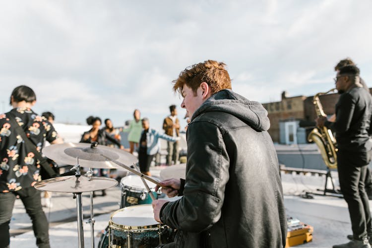 Back View Of A Person Playing The Drums