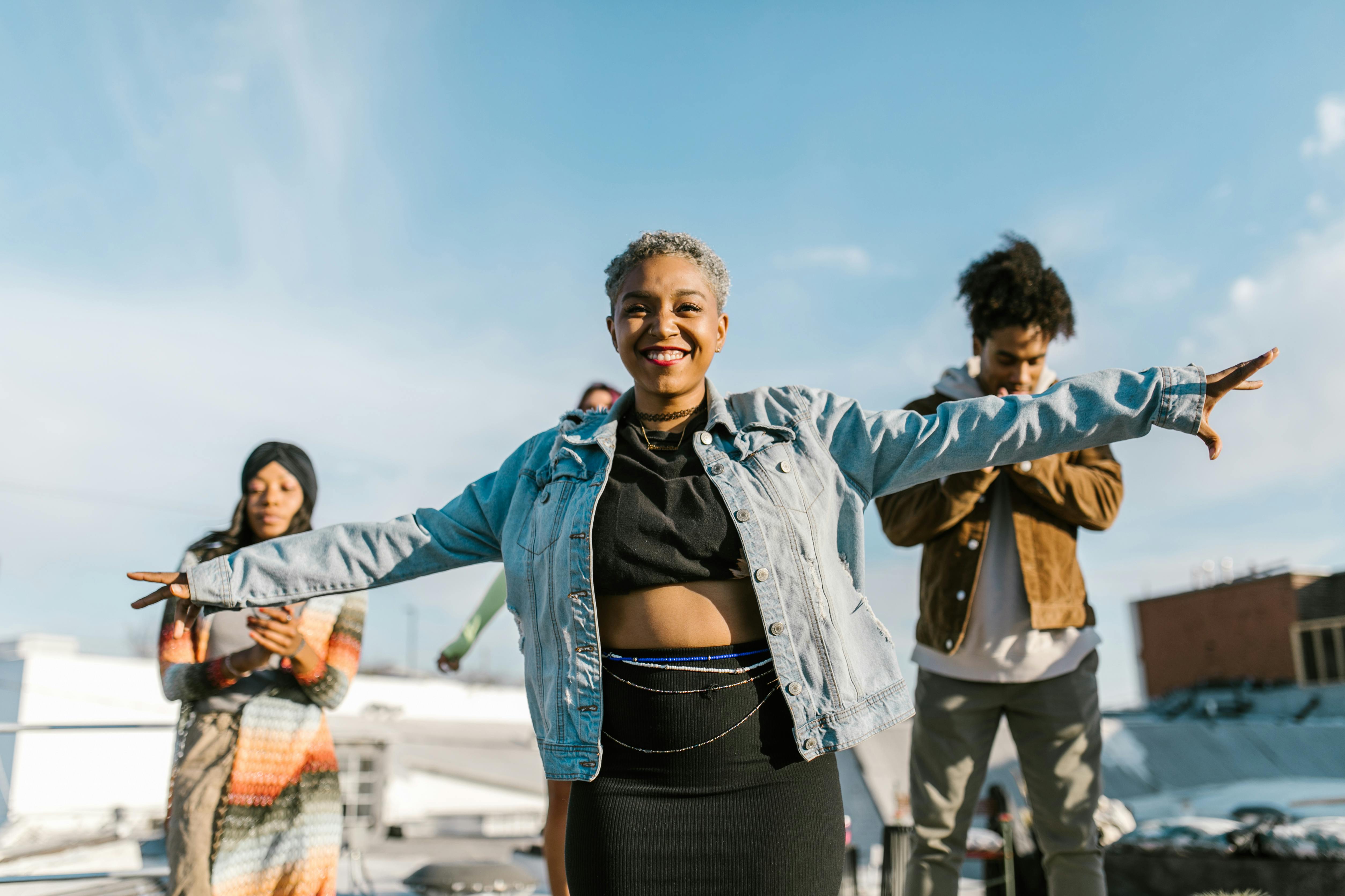 Woman in Blue Jacket Standing on Street