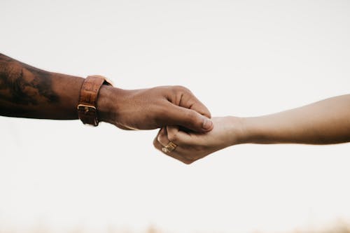 Man and Woman Holding Hands