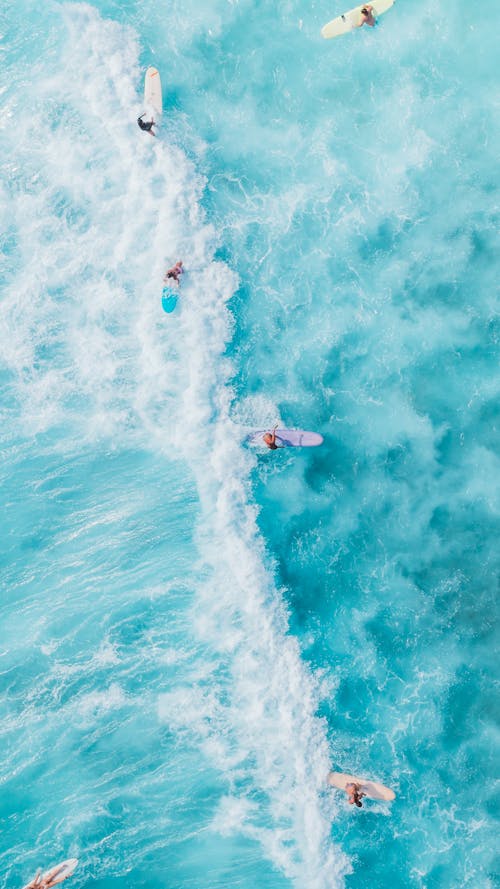 Person Surfing on Blue Ocean Water