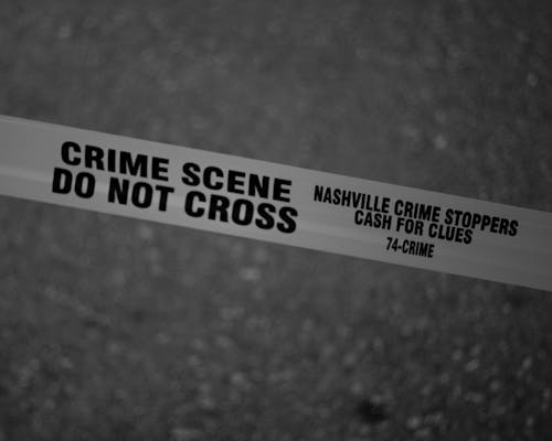 Grayscale Photo of Crime Scene Do Not Cross Tape