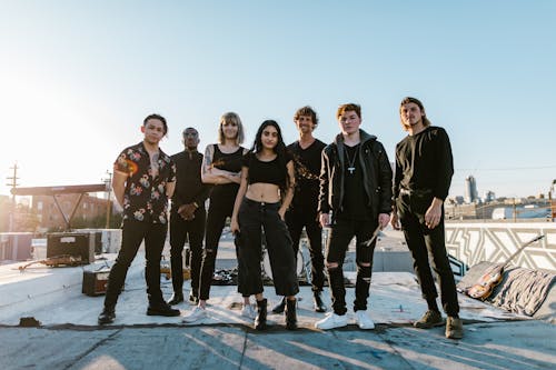 Group of People Standing on Concrete Floor