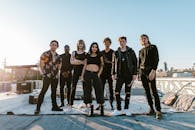 Group of People Standing on Concrete Floor