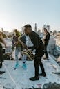 Man in Black Clothing Playing Saxophone