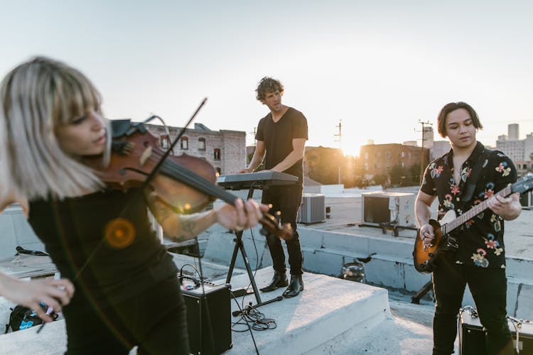 A Band Performing On A Rooftop