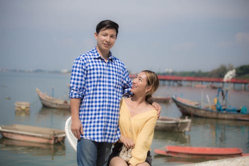 Woman Looking at a Man in Blue Checkered Shirt