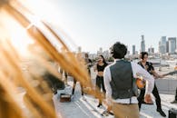Music Band in Black Clothes Playing on the Rooftop
