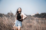Photo of a Woman Posing with Her Hand on Her Waist