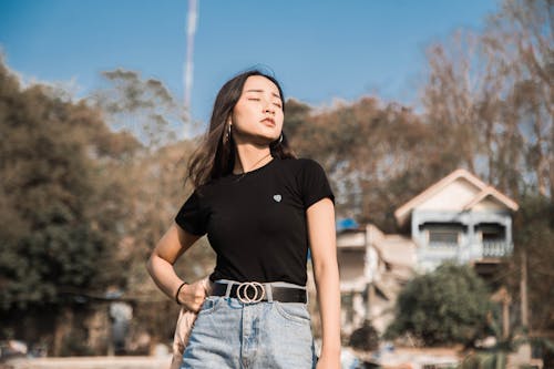 Portrait of a Young Woman Outdoors with Eyes Closed