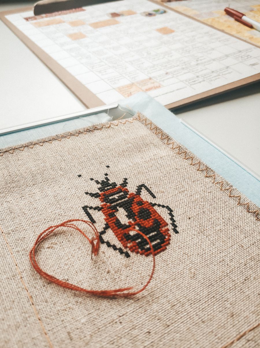 Cross-stitch beetle on linen
