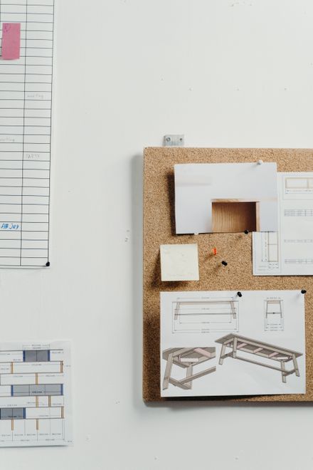 Corkboard of pinned studio drawings, photo by cottonbro studio on Pexels