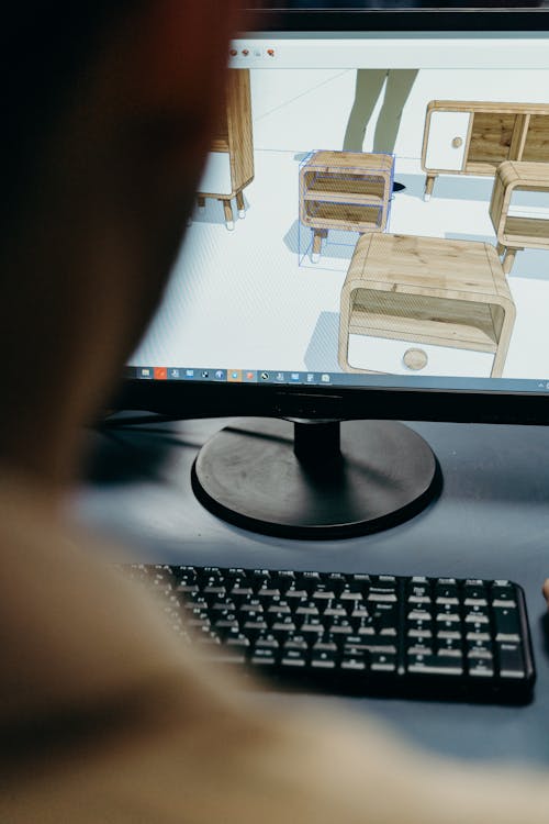Computer. Man Design A Man Using a Computer in Designing · Free Stock Photo