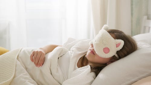Free A Girl Sleeping on the Bed Stock Photo