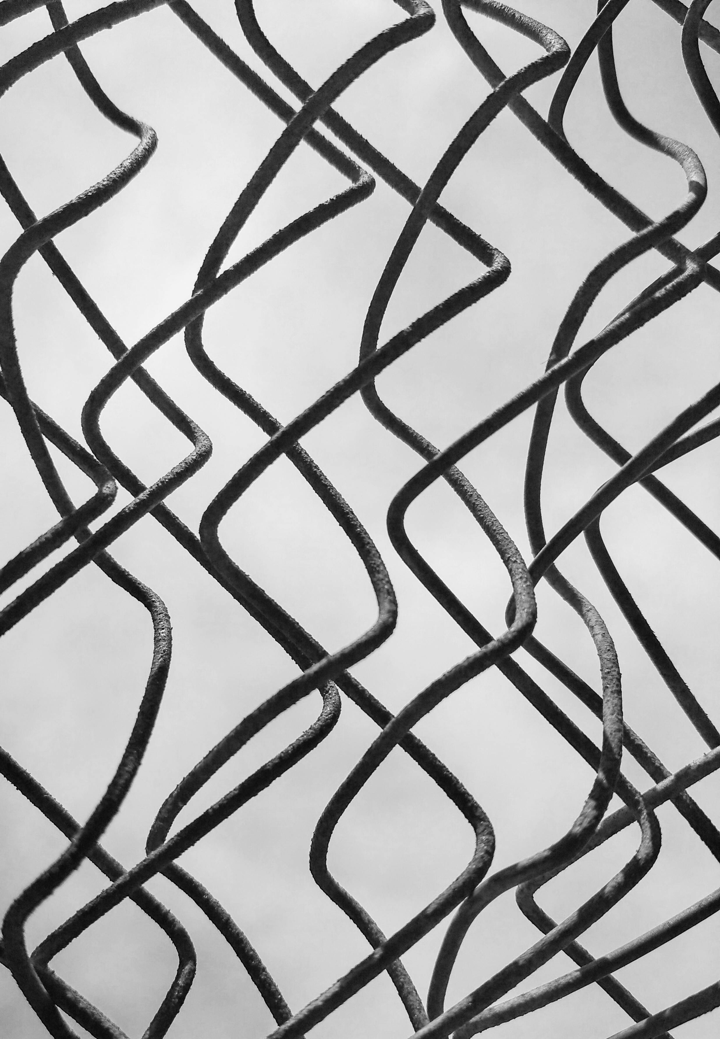 gray curvy metal fence in close up shot