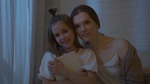 Free Mother and Daughter Looking at the Camera Stock Photo