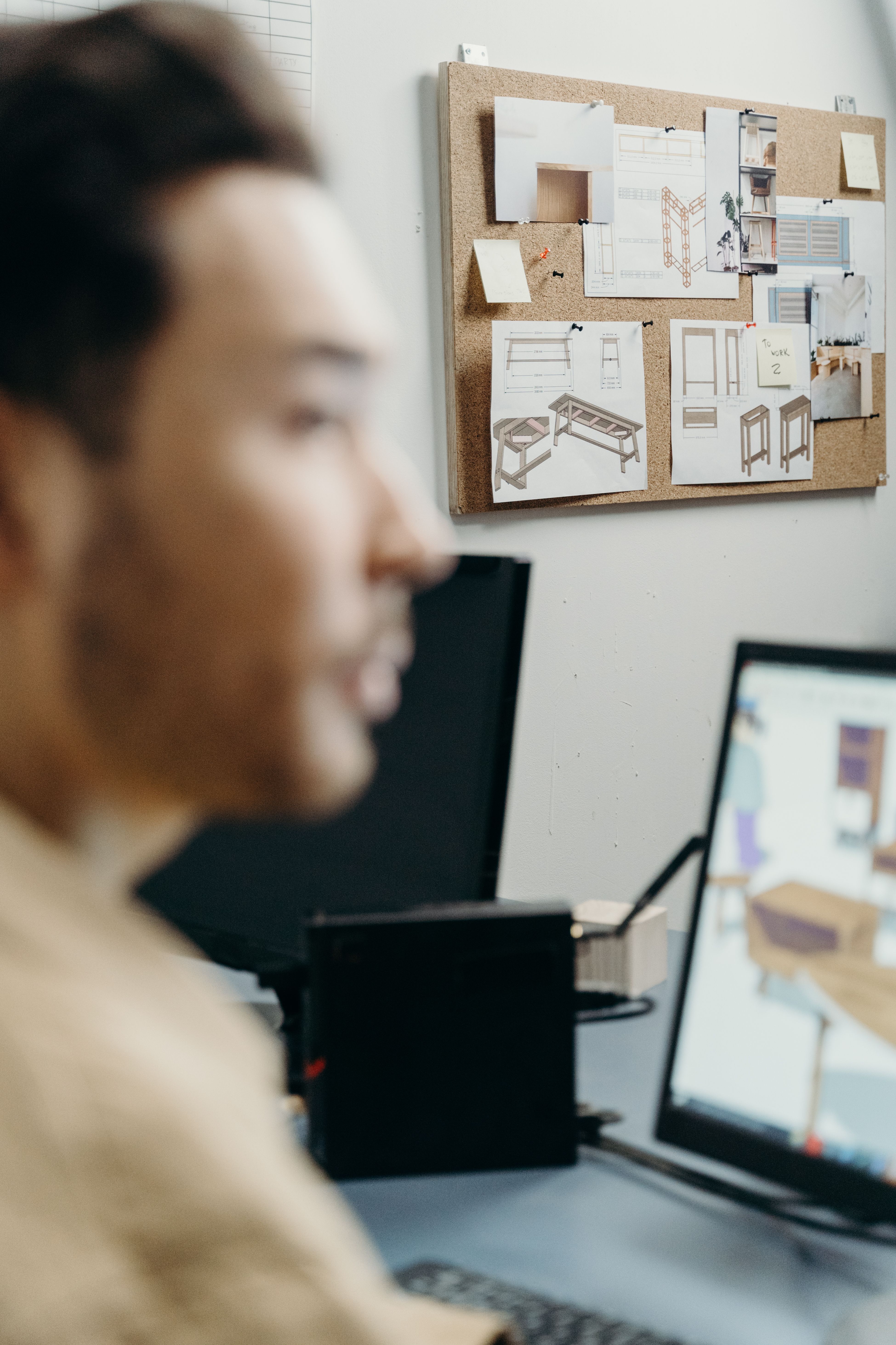A Man Using a Computer in Designing · Free Stock Photo