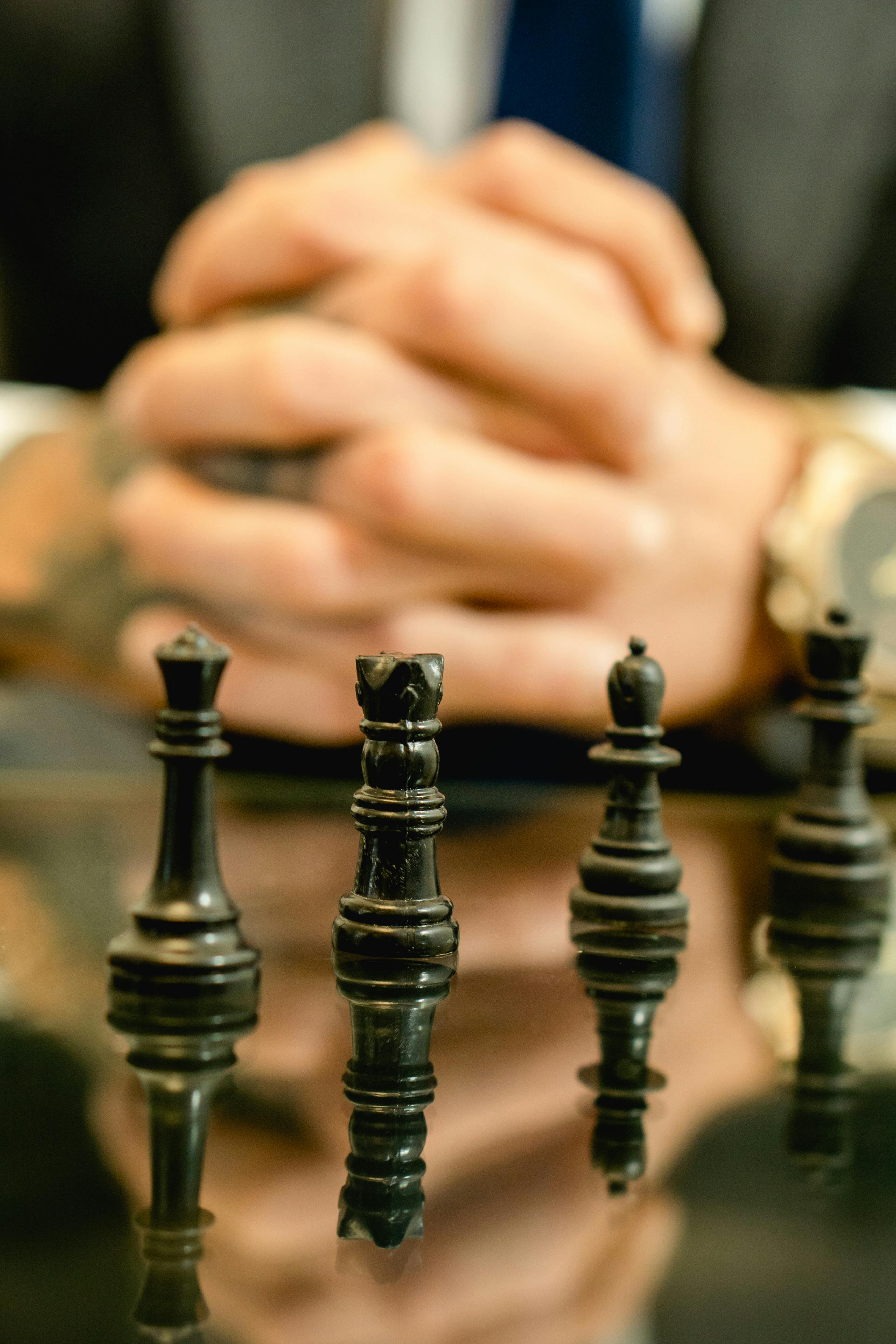 photograph of black chess pieces