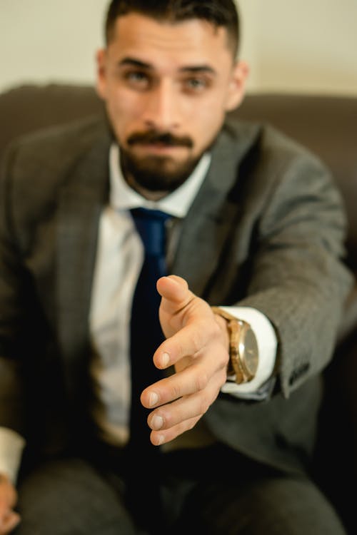 Man Reaching his Hand for Handshake