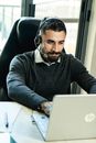 Man in Black Sweater Wearing White Headphones