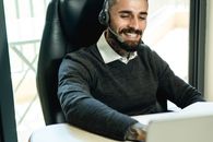 Man in Black Sweater Wearing White Headphones
