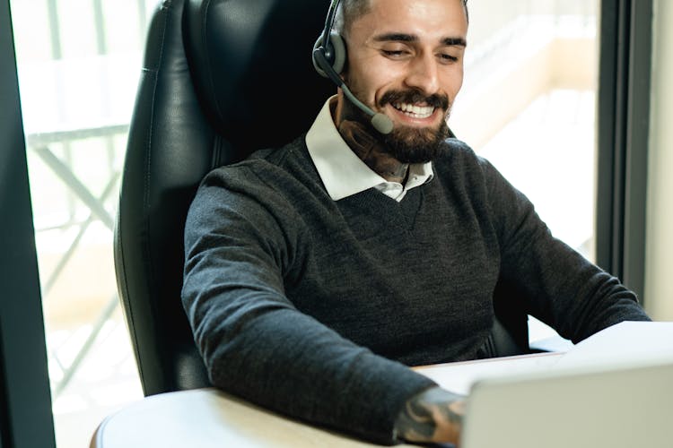 Man Wearing Headset While Working At The Office